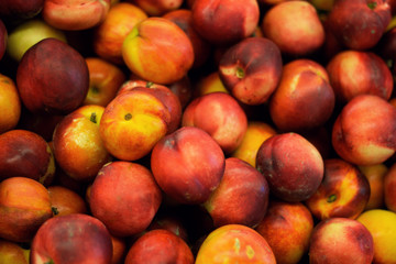 Fototapeta na wymiar top view close up peaches on a market