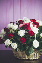 Bouquet of roses in a wooden basket
