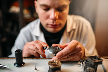 Watchmaker repair old clocks gear