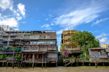 View of Chao Phraya River with blue sky and down-town Old colorful buildings in Bangkok, Thailand