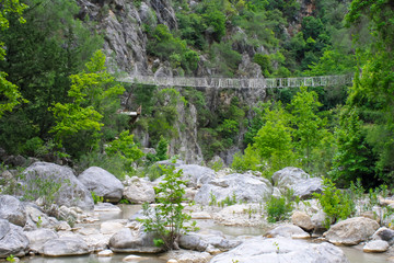 Fototapeta na wymiar rope bridge in the mountains