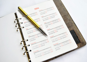 Golden Pen on Notebook