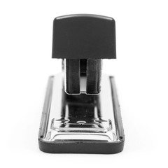 Front view of a chrome stapler with selective focus isolated on white background