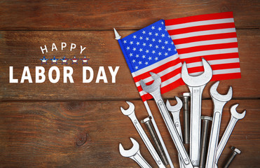Different kinds of wrenches on a wooden background. Labor day concept.