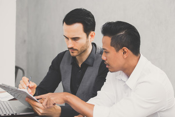 Young Business people working together with serious emotion. Business people takling in modern office. vintage tone.