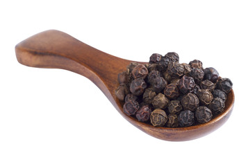 Black pepper in wooden spoon on white background.