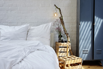 white bed linen creative nighstand metal locker and vivid sun light