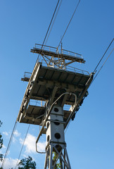 View from bellow of cableway support pillar on sky background.