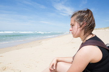 Fototapeta na wymiar alone girl at beach in summer day