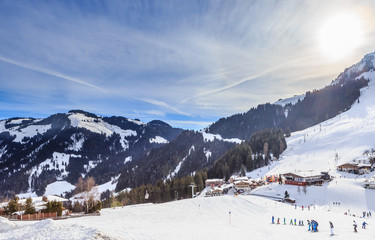 Fototapeta na wymiar Skiers on the slopes of the ski resort of Soll, Tyrol, Austria