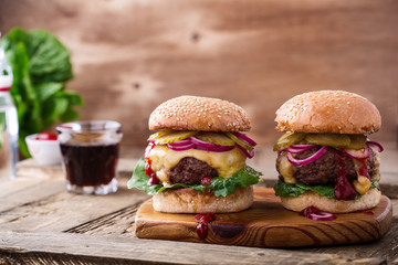 Beef burgers with  gherkins, red onion and lettuce