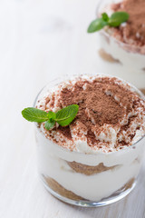 Classic Italian dessert tiramisu served in  glasses