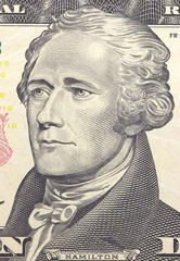 Alexander Hamilton face on US ten or 10 dollars bill macro, united states money closeup.
