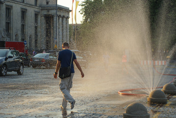 Water curtain. Summer in city. Warsaw - capital of Poland