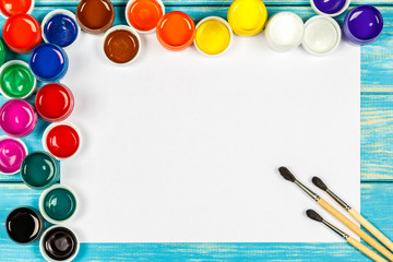 Concept of painting on the blue wooden background