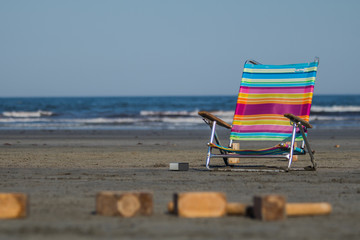 A colorful chair at the beach