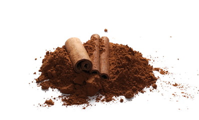 cinnamon sticks and pile cocoa powder isolated on white background