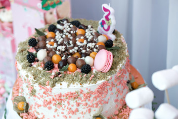 colorful birthday party table with cake