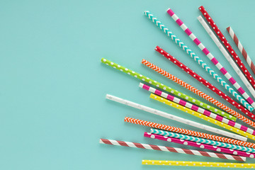 Drinking paper colorful straws for summer cocktails on light blue background. - 159503316