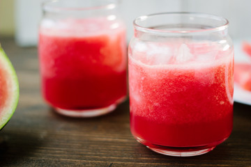 Delicious watermelon smoothie on the wooden board. Smoothie - vegetarian coctail from fresh fruit - watermelon