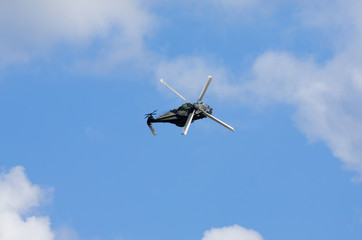 Modern helicopter flying. Image taken from above.