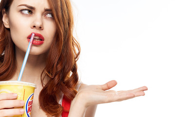 Dissatisfied woman with glass on isolated background