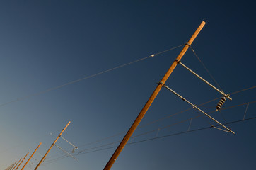 line of wooden posts and wires near railway
Shonto, Arizona, United States