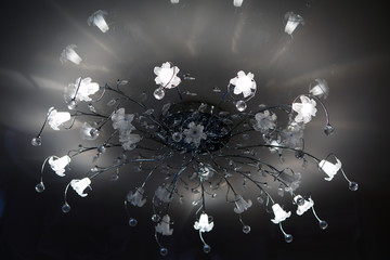 Chandelier ceiling with a globe of interior light indoor. Lamp for large spaces. 