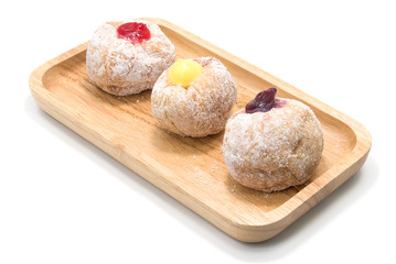 Tasty donuts with jam on white background.