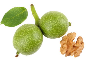Green walnuts with leaves isolated on a white background