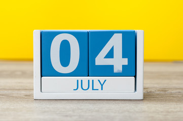 July 4th. Image of july 4 calendar on yellow background. Summer day. Empty space for text. Independence Day Of America