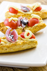 Tasty appetizer of canapes and vegetables