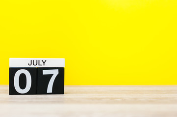 July 7th. Image of july 7, calendar on yellow background. Summer time. With empty space for text