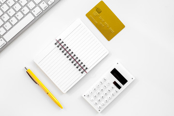 online purchasing with credit cards and notebook white manager desk background top view mock-up