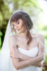 Blonde bride in fashion white wedding dress with makeup