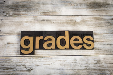 Grades Letterpress Word on Wooden Background