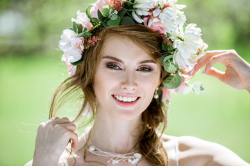 Naklejka premium Closeup blonde bride with fashion wedding hairstyle and makeup