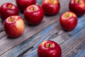 Seasonal. Autumn. Red apples on the rustic wooden surface