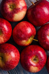 Seasonal. Autumn. Red apples on the rustic wooden surface