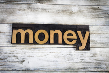 Money Letterpress Word on Wooden Background