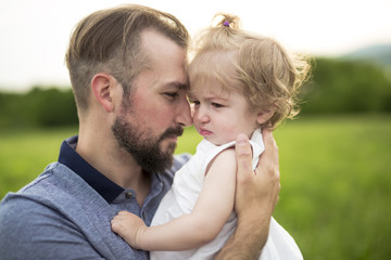 Fototapeta premium Beautiful portrait of young attractive father with daughter toddler