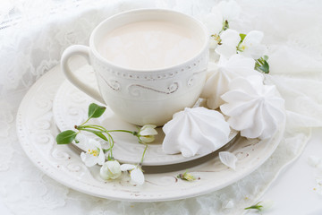 Obraz na płótnie Canvas Porcelain cup of tea with milk on white background