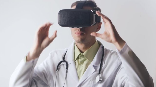 Doctor uses a virtual reality glasses.