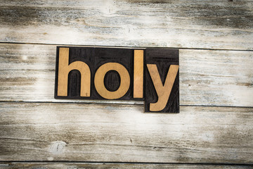 Holy Letterpress Word on Wooden Background