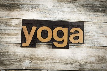Yoga Letterpress Word on Wooden Background