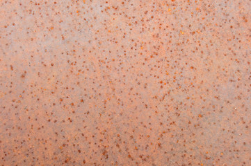 Old textured rusty metal sheet with small spots