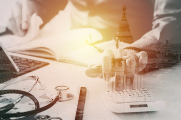 Healthcare costs and fees concept.Hand of smart doctor used a calculator for medical costs in...