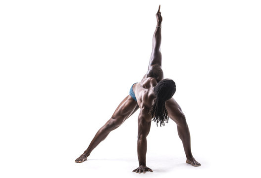 Black Muscular Handsome Young Man Doing Yoga Exercises In Studio, Isolated On White Background. Full Body