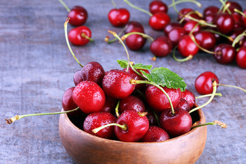 Cherry bowl with sweet cherries with leaf