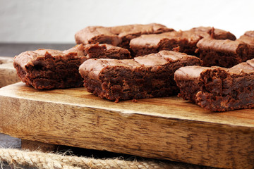 Brownie stack, chocolate cake on rustic wooden board